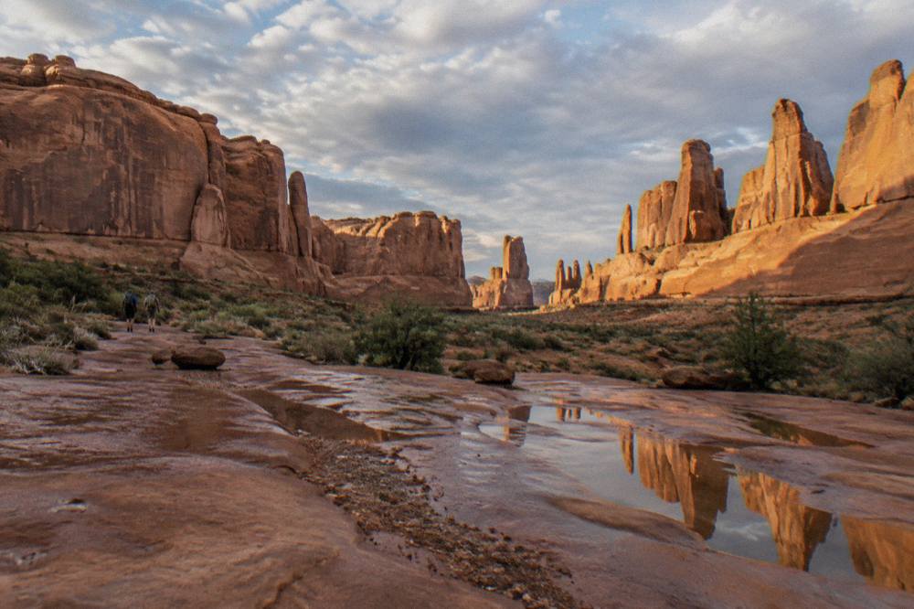 Sandstone fins and towers of Arches glowing in late afternoon light