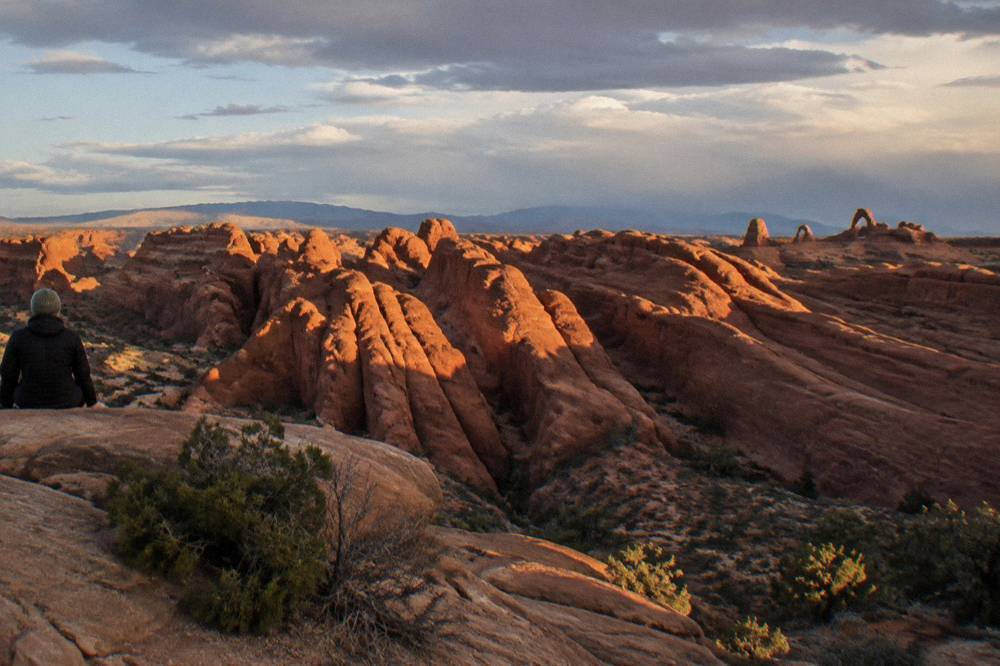 Sunlight striking sandstone fins inside Arches National Park in late afternoon