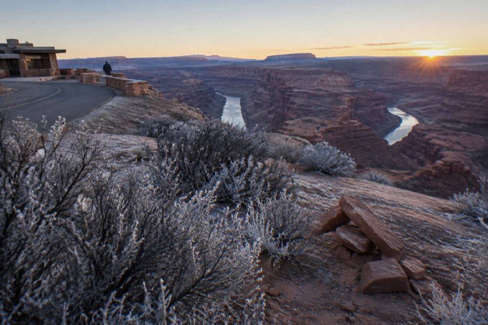 High desert mesa overlooking canyons carved by two rivers in the distance