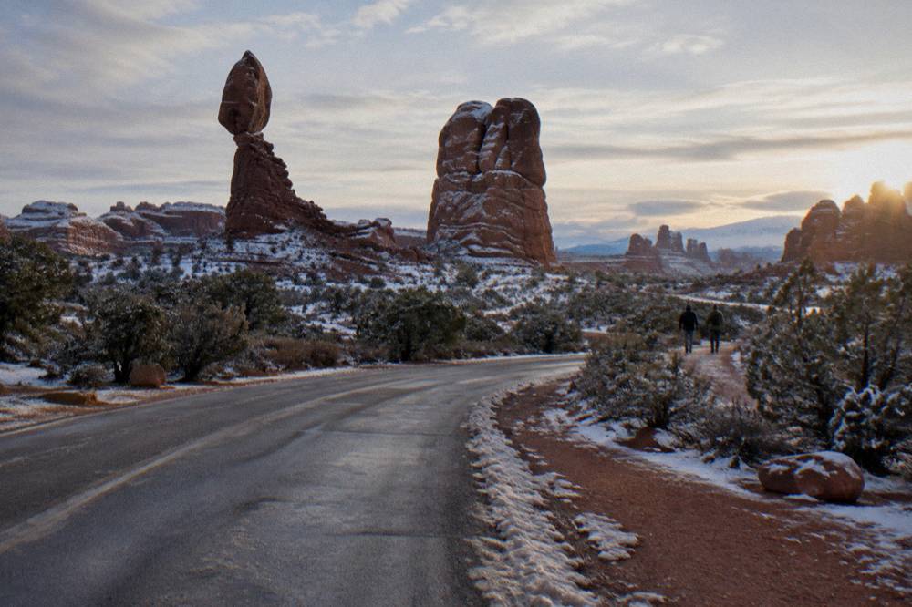 Morning light on sandstone fins along the paved scenic drive inside Arches